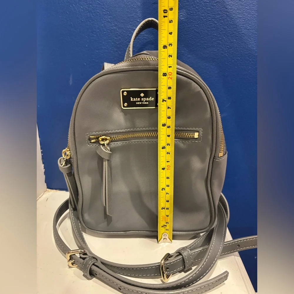 Kate Spade New York Mini Bradley nylon backpack in gray with gold zippers